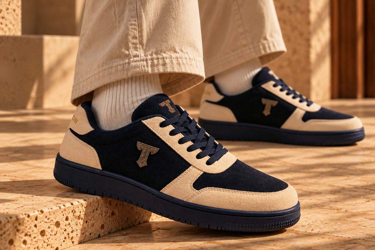 Woodland Fox black-and-cream sneakers on a herringbone floor