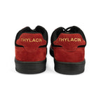 Thylacin Ember Wolf low-top sneakers in crimson red and black suede — heel view of a pair