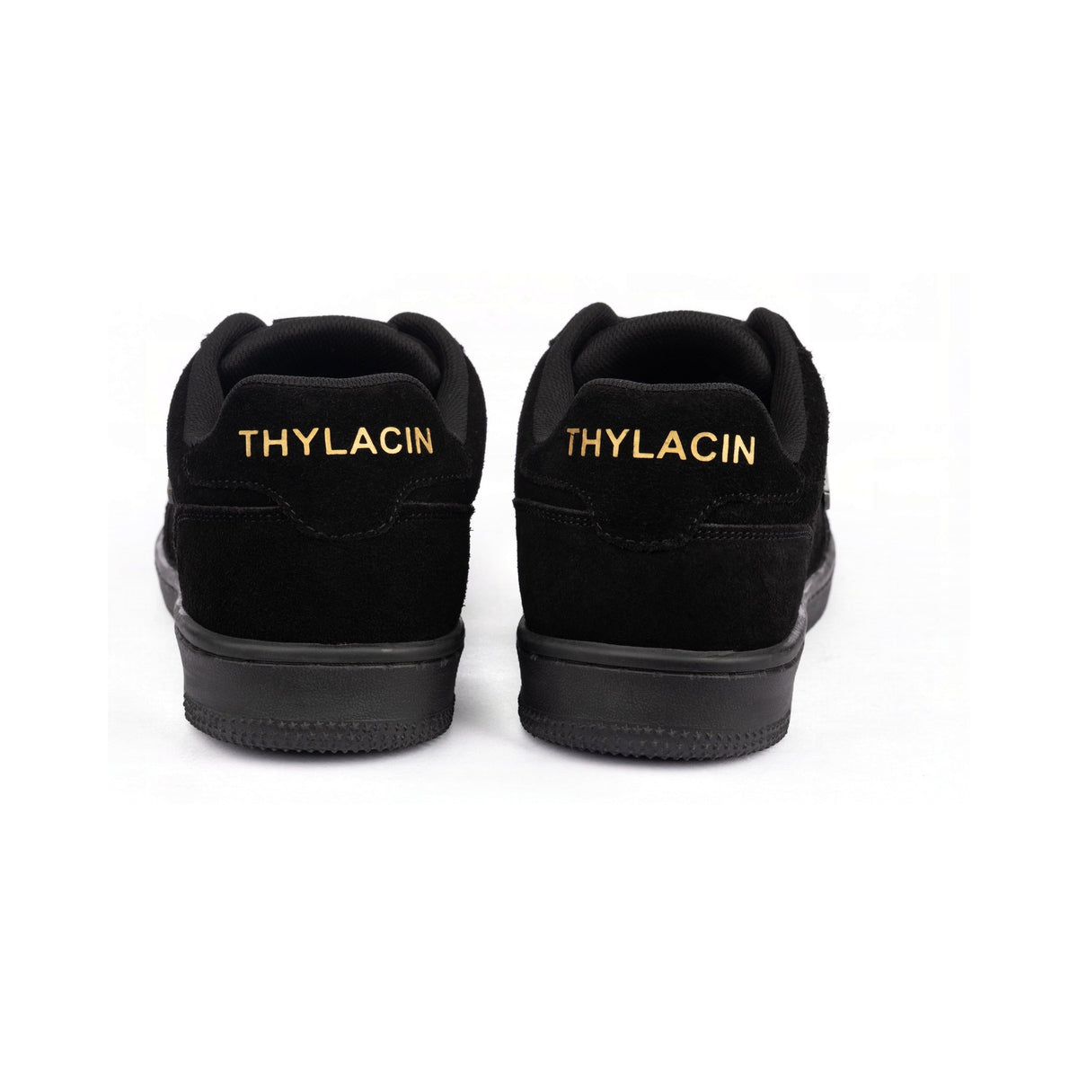 Thylacin Midnight Panther low-top sneakers in all-black suede — heel view of a pair