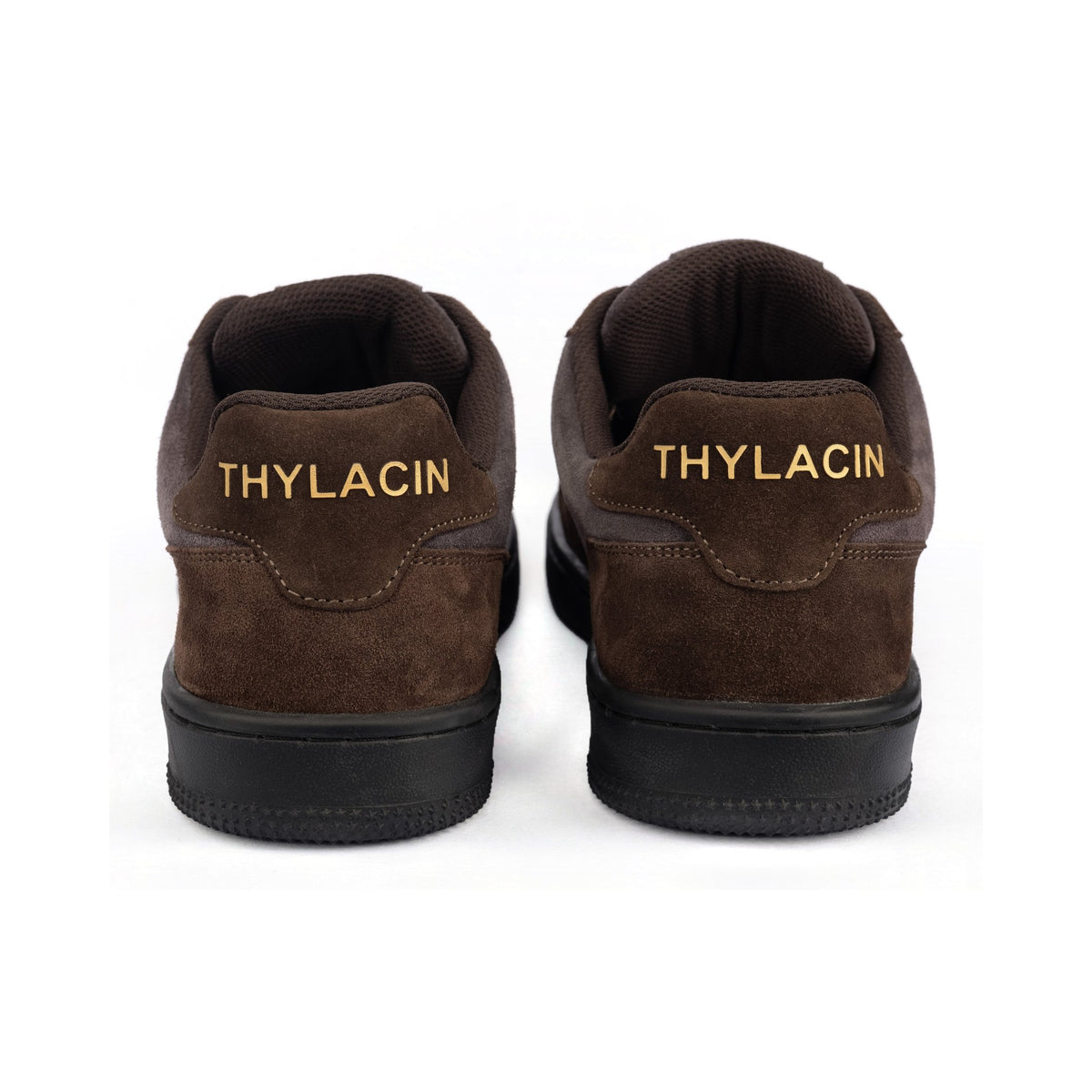 Thylacin Shadow Lynx low-top sneakers in brown and slate suede — heel view of a pair
