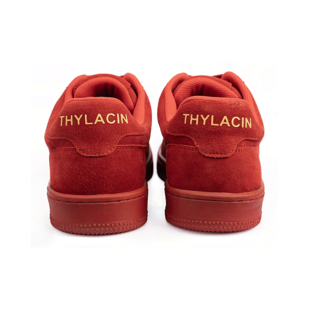 Thylacin Wild Wood Bear low-top sneakers in all-red suede — heel view of a pair