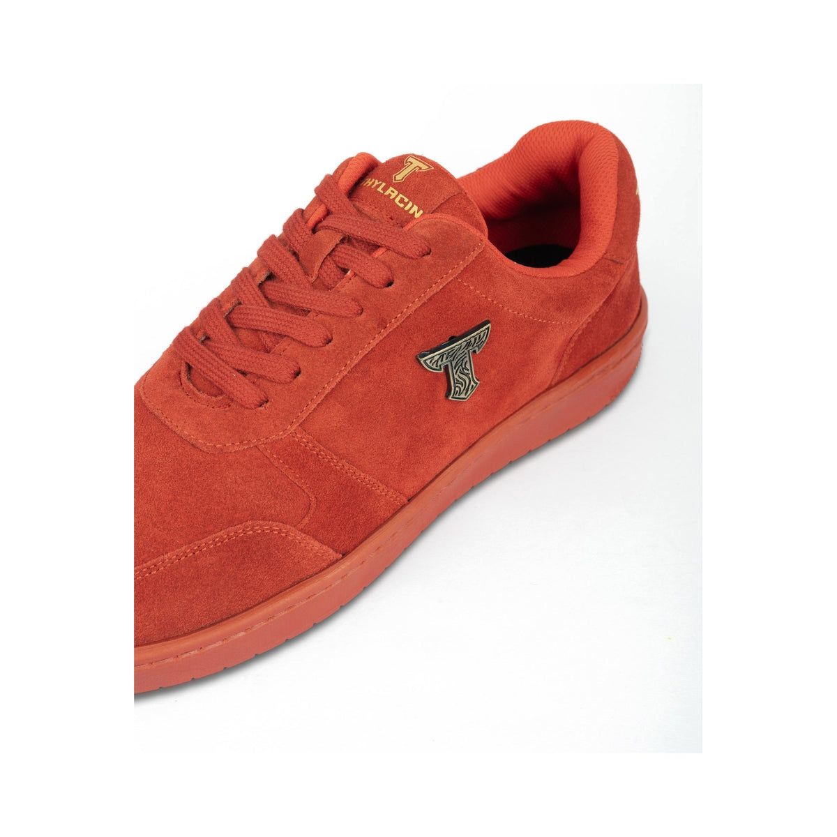 Thylacin Wild Wood Bear low-top sneaker in all-red suede — close-up of the suede and logo badge on the shoe