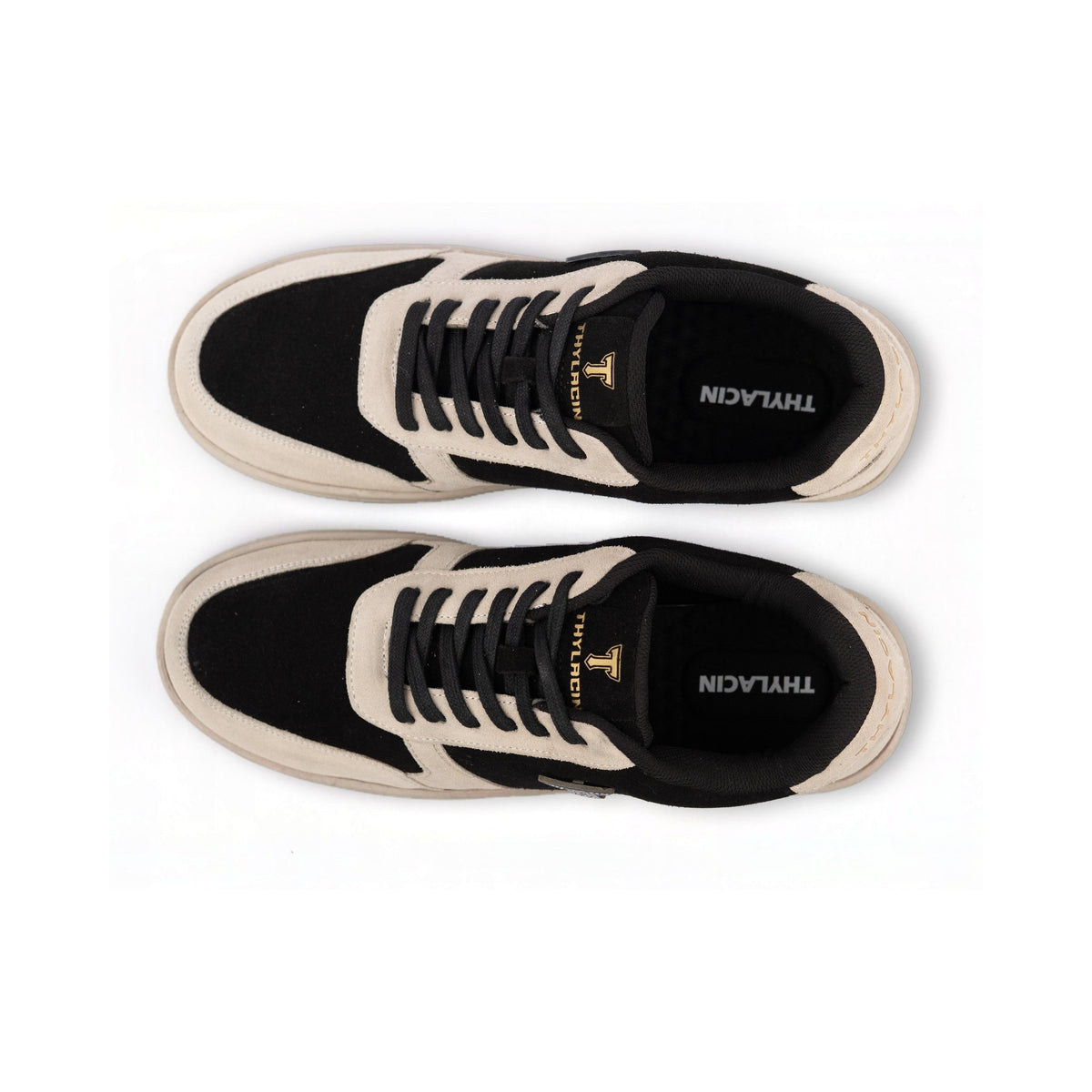 Thylacin Woodland Fox low-top sneakers in black and cream suede — top-down view of a pair